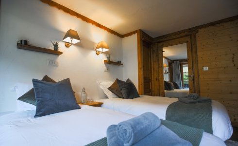 twin bedroom in catered chalet in morzine