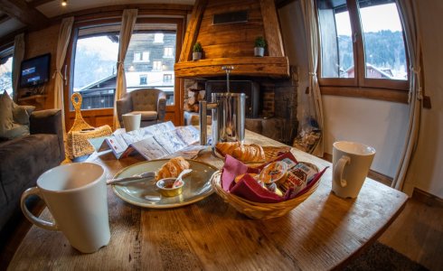 Piste maps and coffee at Chalet Atlas