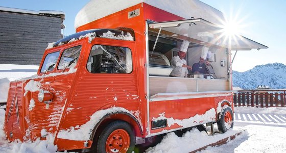 Vintage crêpe van in the snow outside the hotel