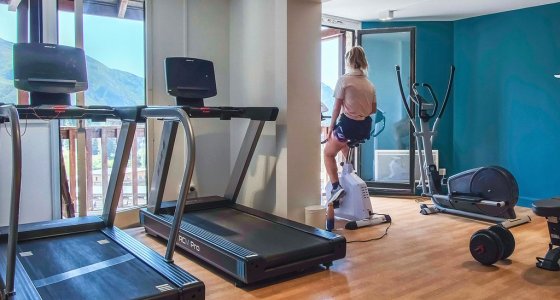 Hotel gym with treadmills and mountain views