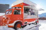 Vintage crêpe van in the snow outside the hotel