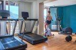 Hotel gym with treadmills and mountain views